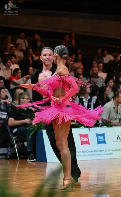 Dancesport competitor: Male dancer: black sleeveless top and black trousers