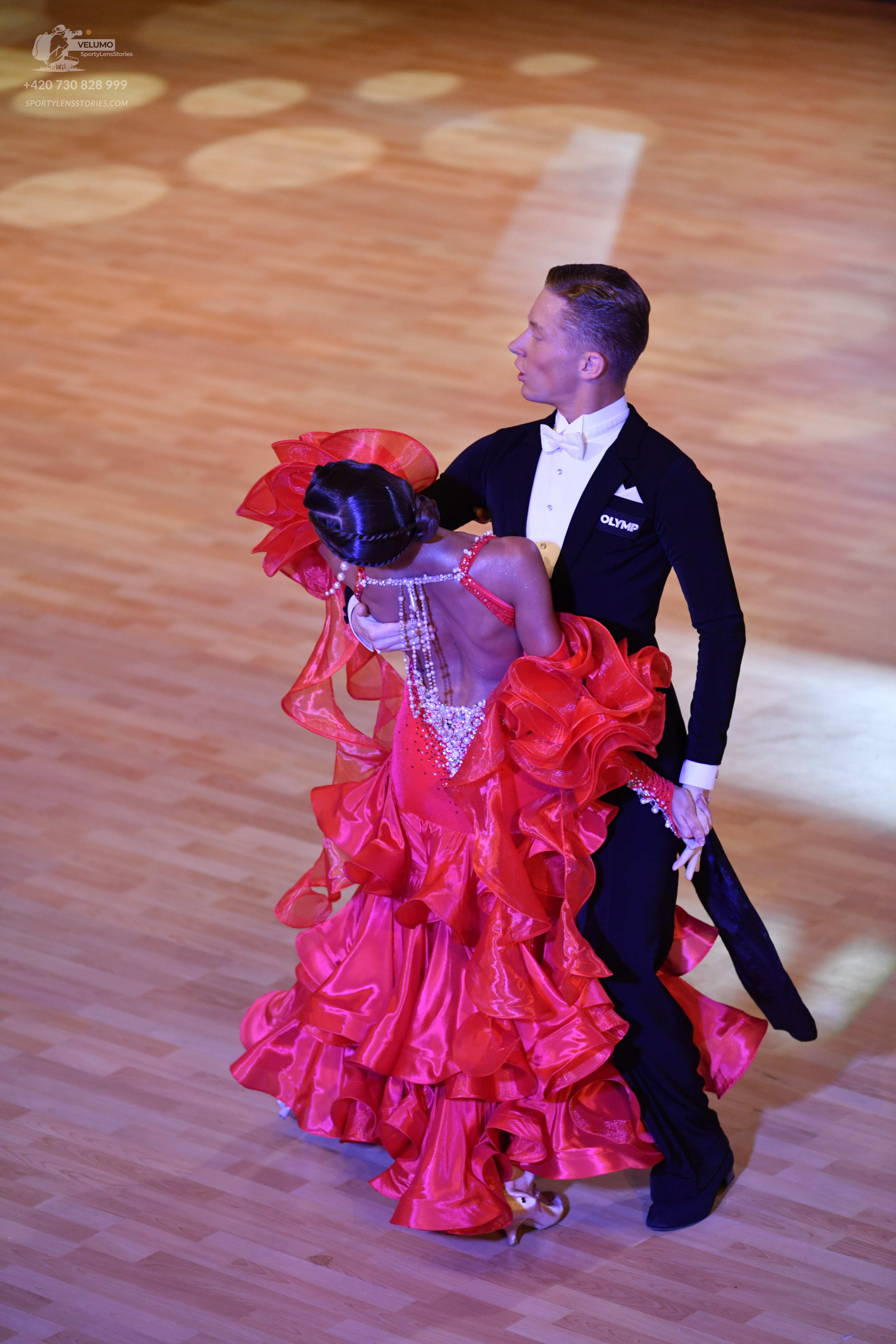Dancesport competitor: ** Male: Black tailsuit with a sequin lapel