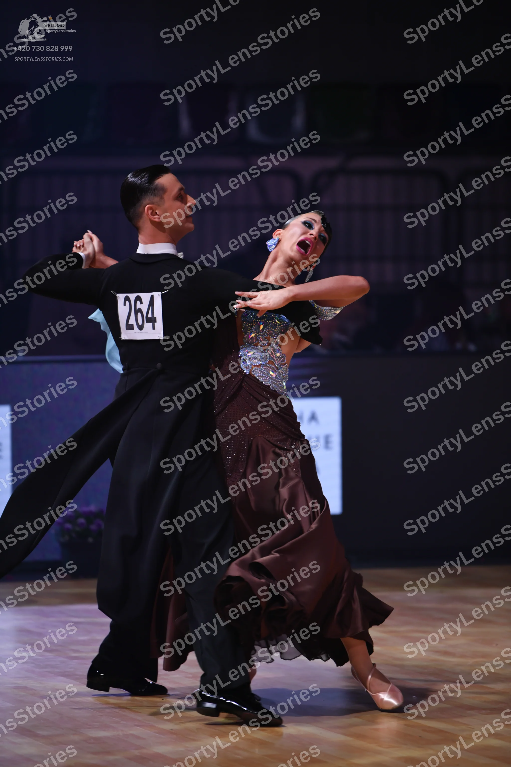 Dancesport competitor: Male dancer: black tailcoat, white wing collar shirt, black trousers, and black