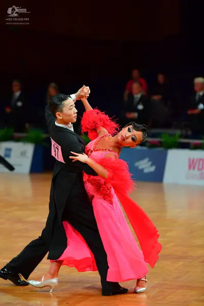Dancesport competitor: Male dancer: black tailcoat suit with black trousers and black shoes