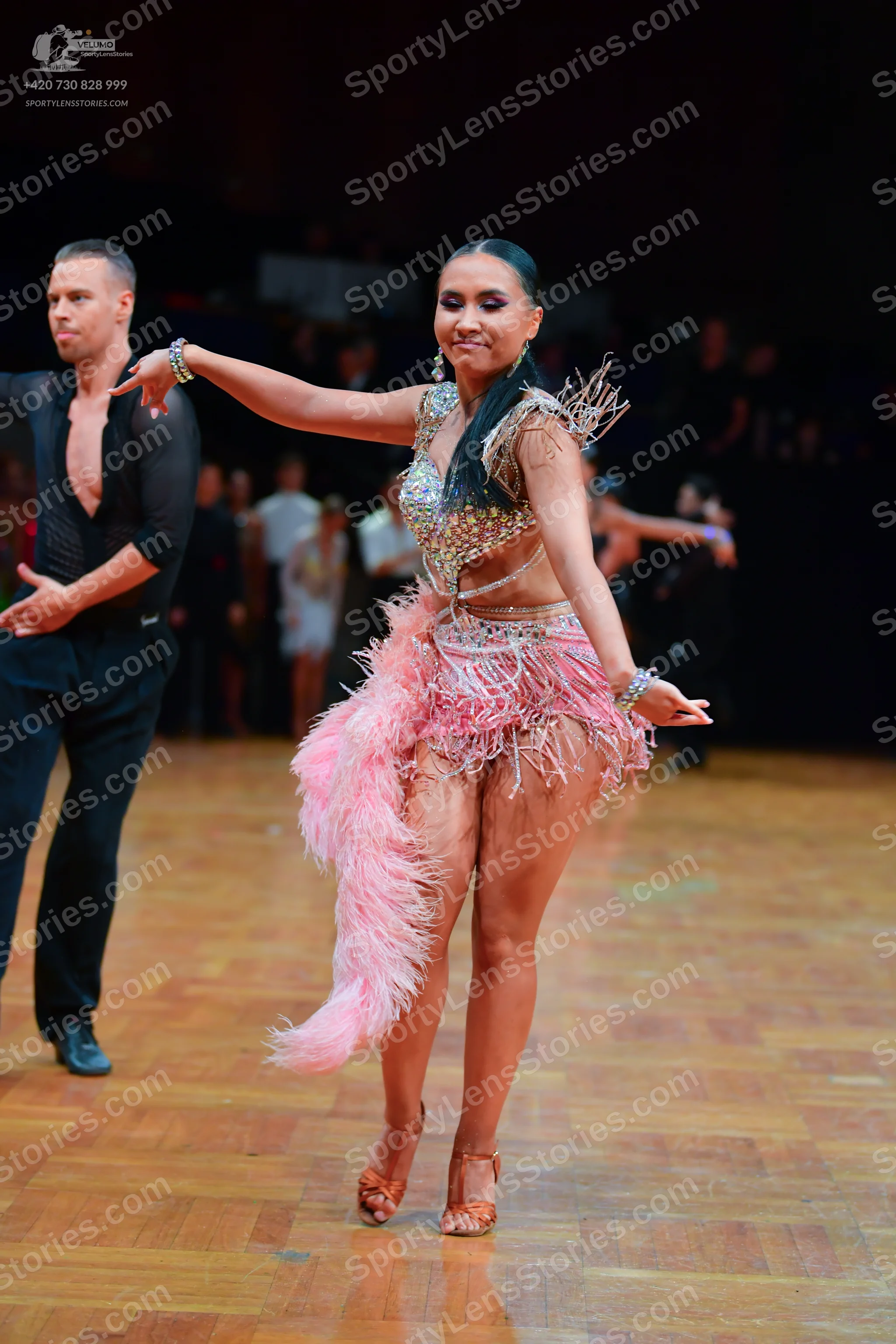 Dancesport competitor: Male dancer: black shirt with a deep V-neck and black trousers