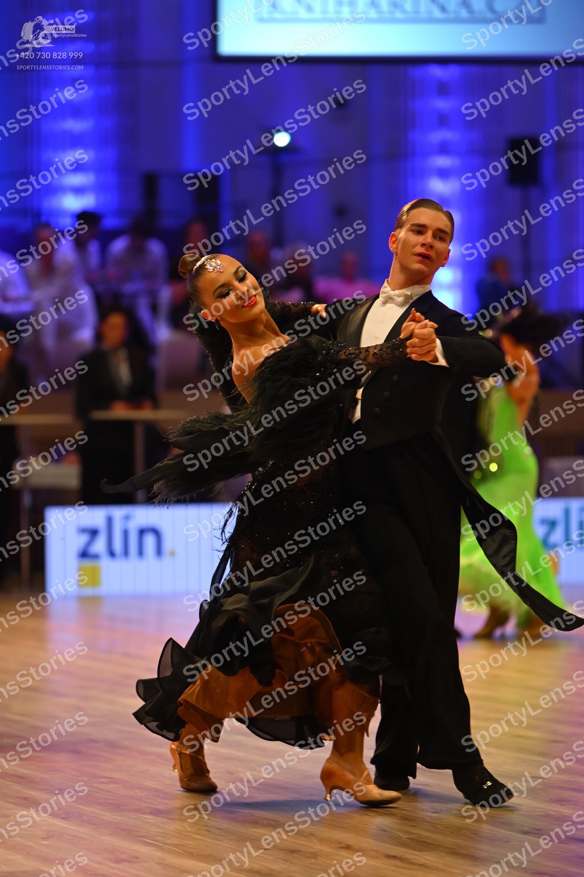 Dancesport competitor: Male dancer: black suit with a white shirt and black trousers