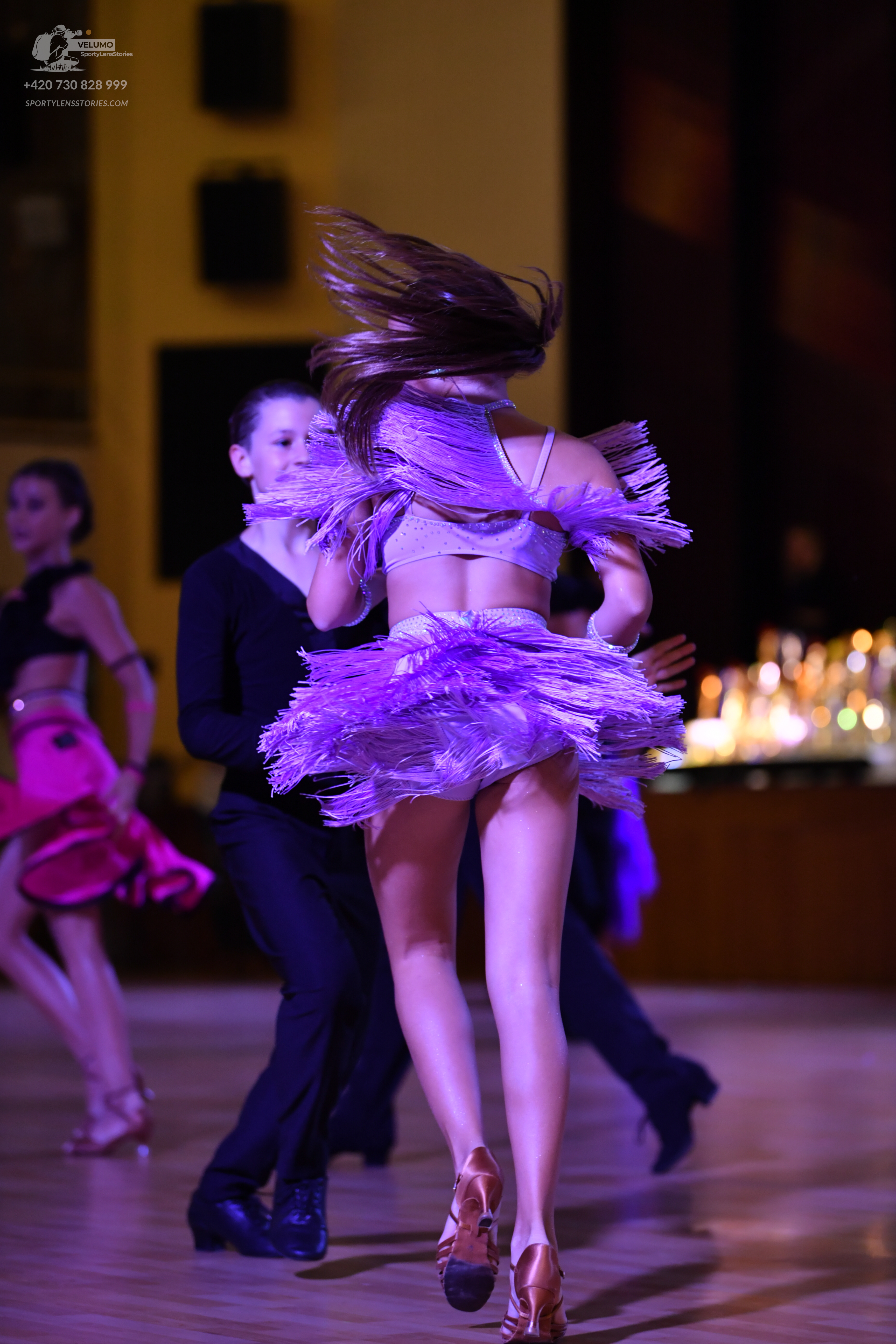 Dancesport competitor: Male (Left)**

*   **Color:** Black
*   **Fabric:** Satin (likely with a sheen)
