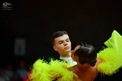 Dancesport competitor: Male dancer: white shirt and dark jacket