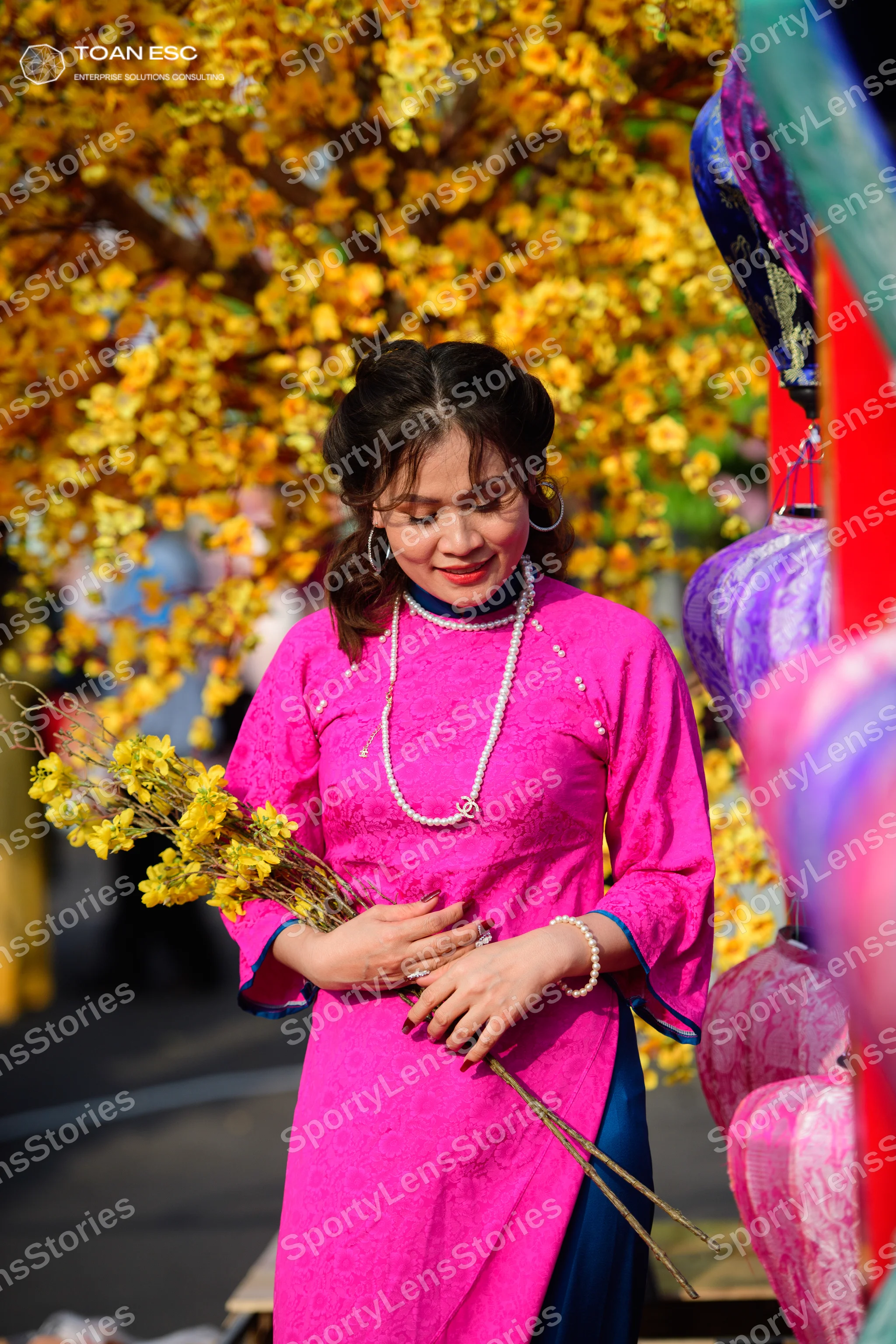Dancesport competitor: Female dancer: magenta textured long-sleeved dress with a pearl necklace and pea