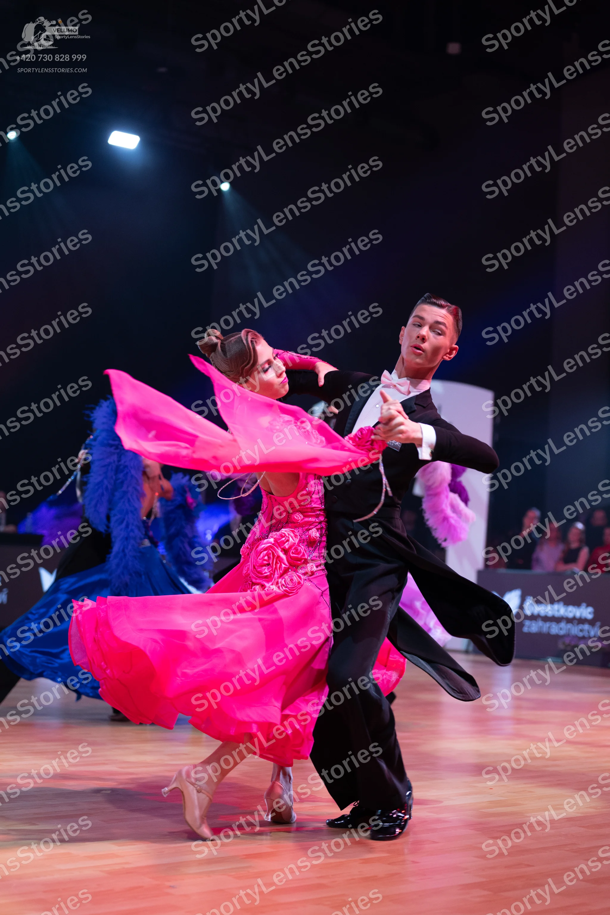 Dancesport competitor: Male dancer: black suit with a white shirt and black trousers