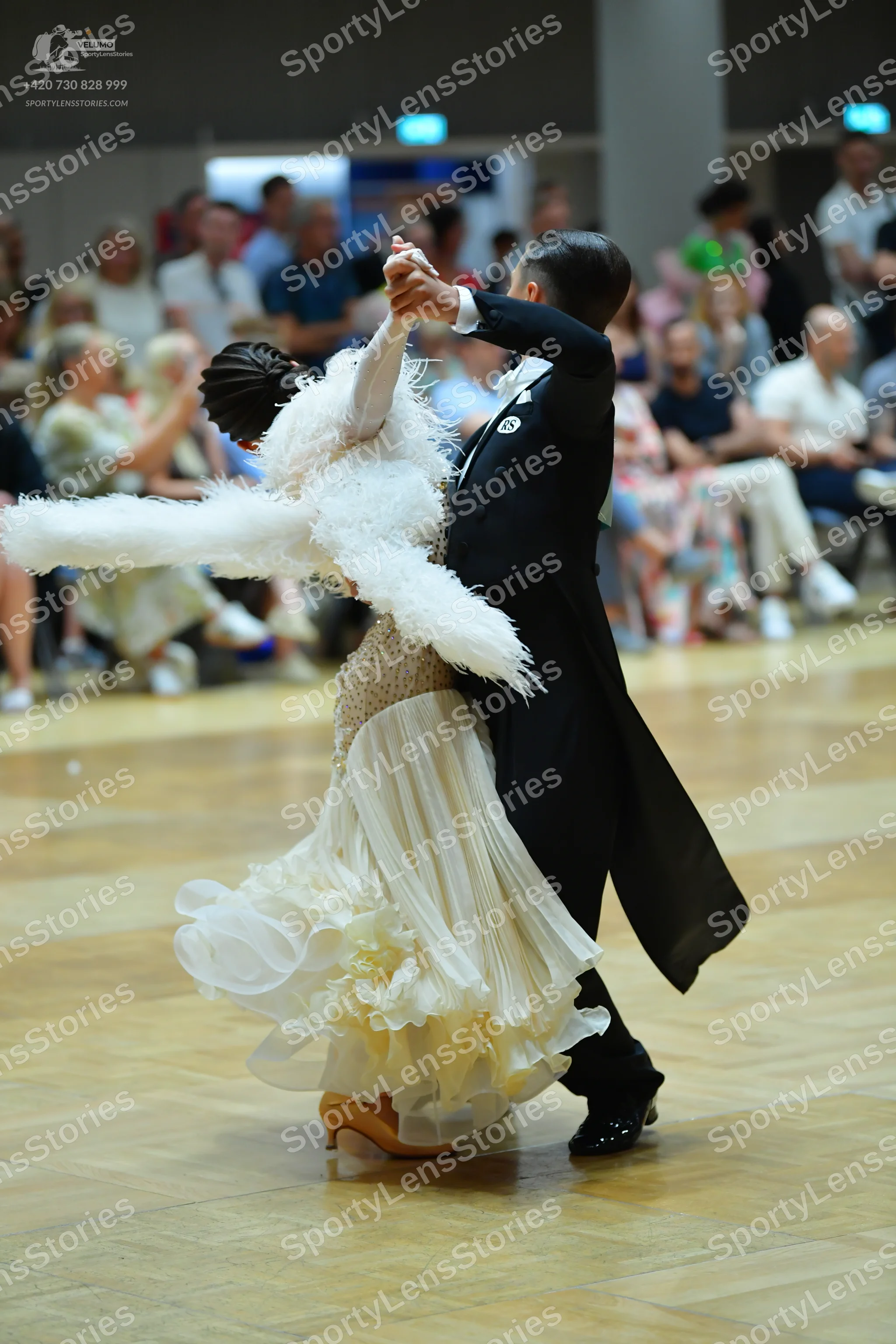 Dancesport competitor: Male dancer: black tailcoat, black trousers, and black dance shoes