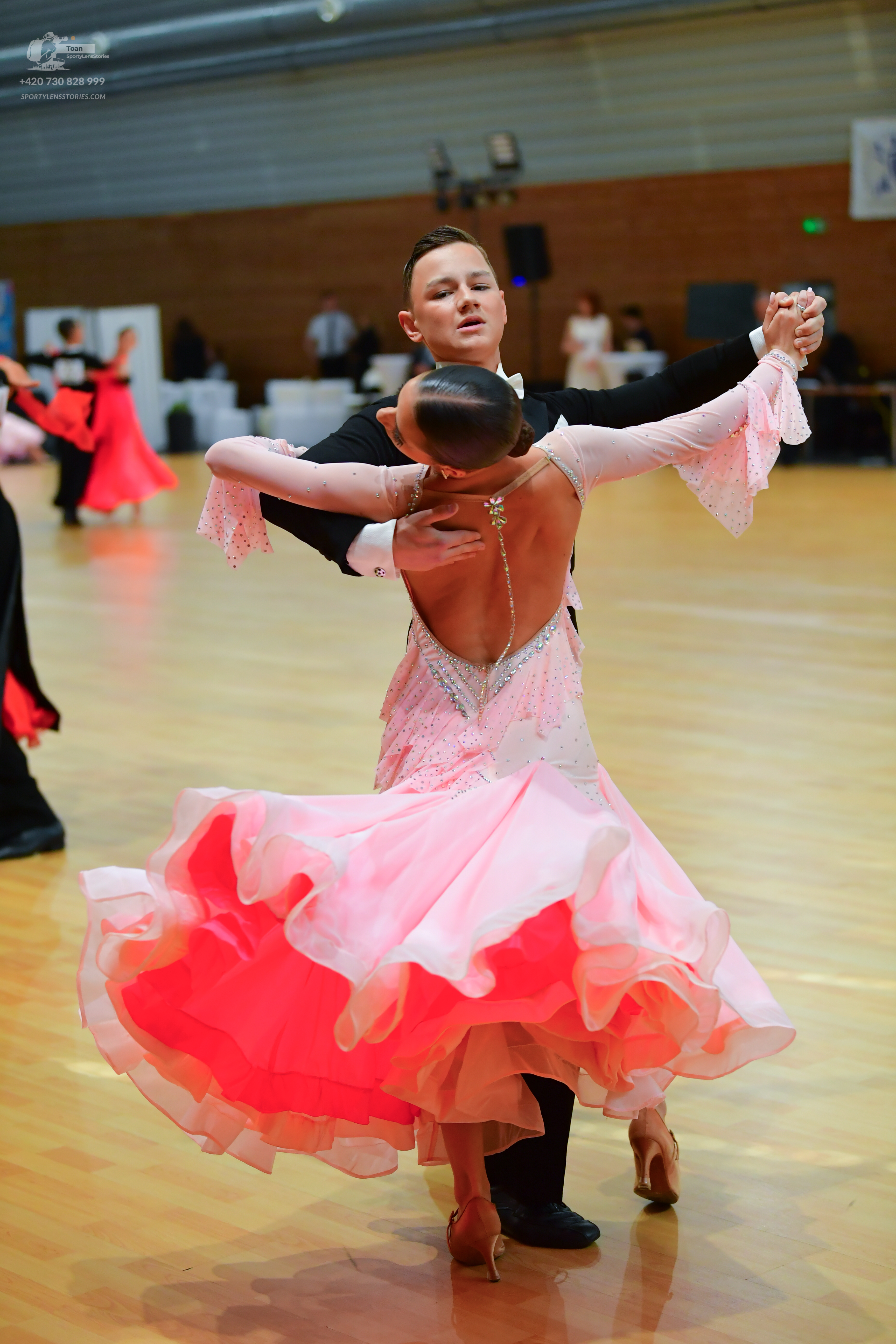 Dancesport competitor: ** Black tailsuit with sequin lapels