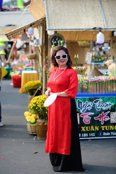 Dancesport competitor: Female dancer: red long-sleeved midi dress with black skirt, featuring a subtle 
