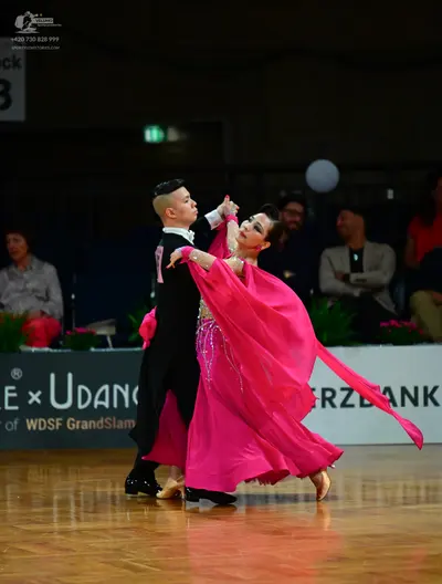 Dancesport competitor: Male dancer: black long-sleeved top and black trousers