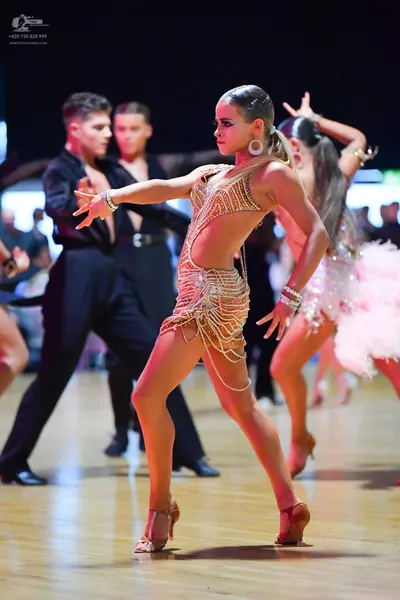 Dancesport competitor: Male dancers: black long-sleeved shirts and black trousers