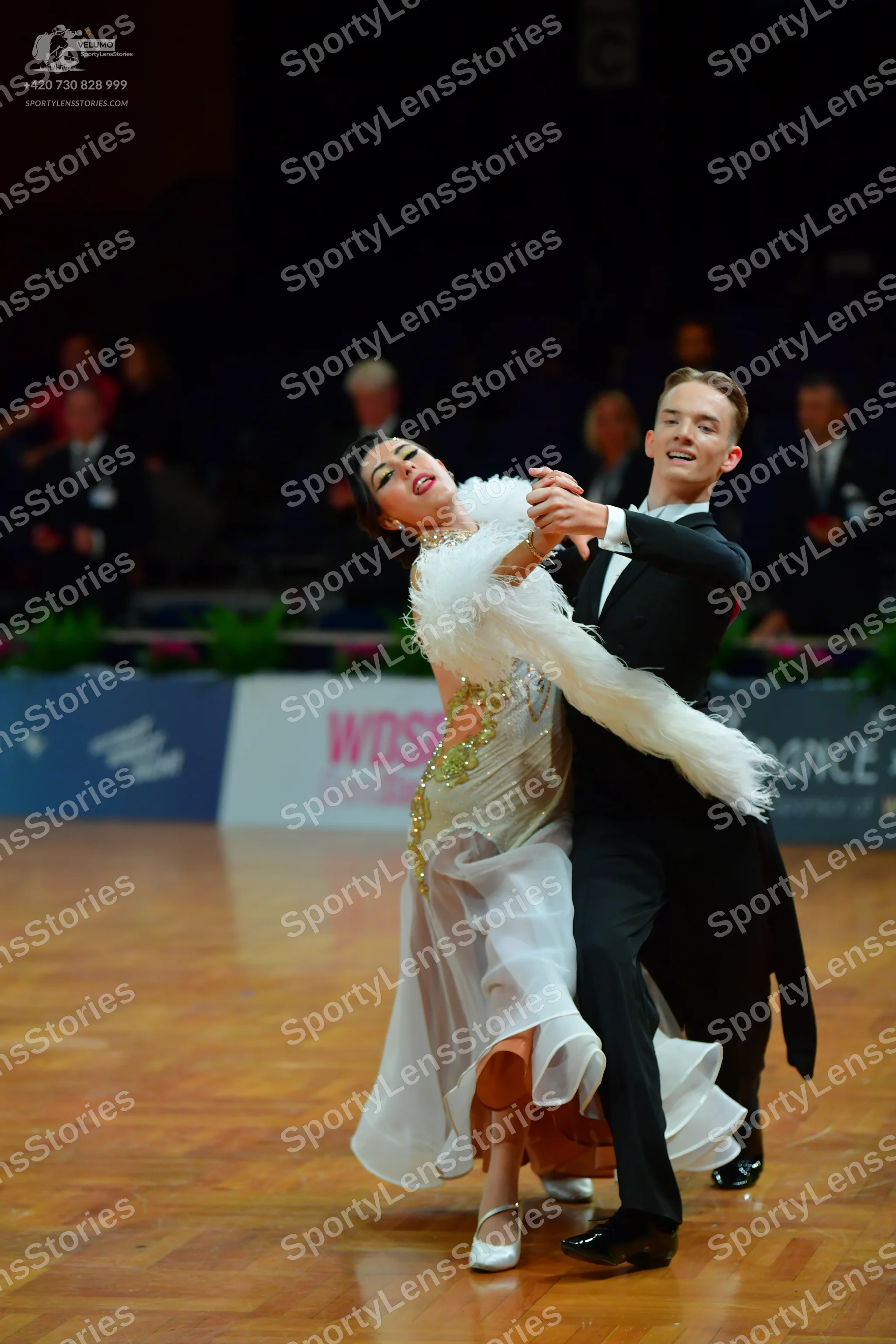 Dancesport competitor: Male dancer: black suit with a white shirt and black bow tie