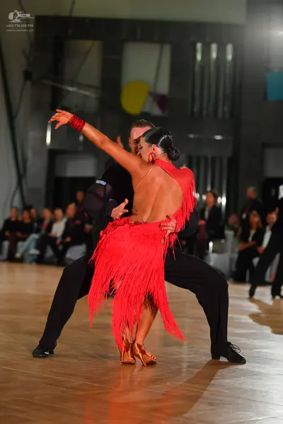 Dancesport competitor: Male dancer: black long-sleeve shirt and black trousers