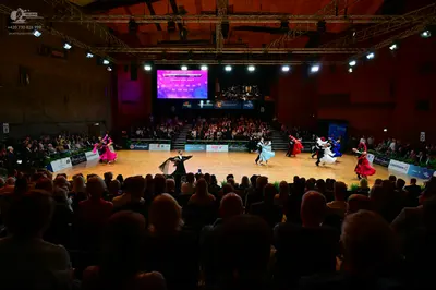 Dancesport competitor: Female dancer (far left): pink ballgown with a voluminous skirt