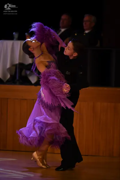 Dancesport competitor: ** Black tail suit