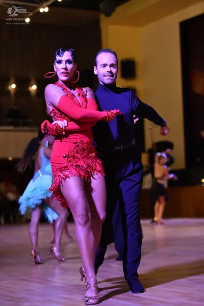 Dancesport competitor: Black suit with sequin lapels, black trousers, and black shoes