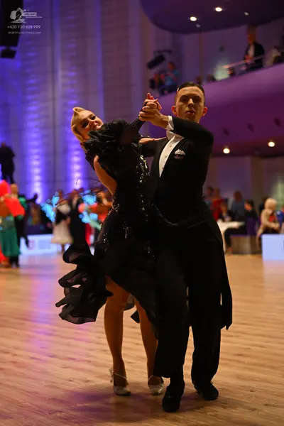 Dancesport competitor: Male dancer: black tailcoat, white shirt, white bowtie, black trousers, and blac