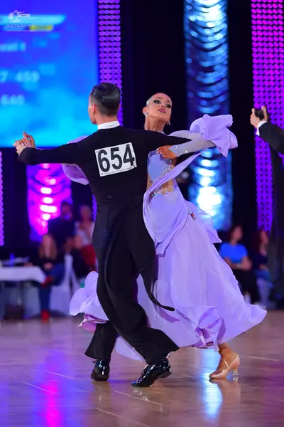 Dancesport competitor #654: Male dancer: black long-sleeved top and black trousers