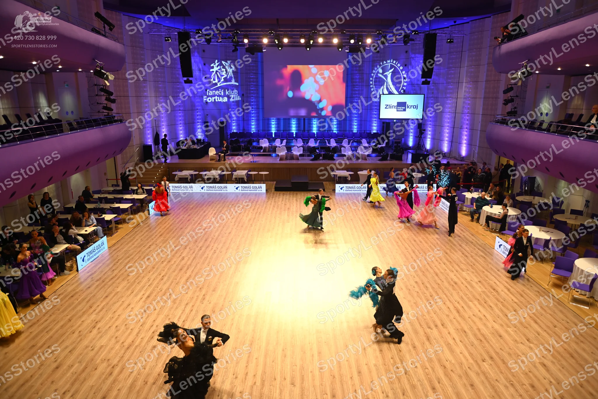 Dancesport competitor: Male dancer (foreground): black suit with white shirt