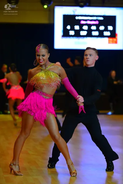 Dancesport competitor: Male dancer: black long-sleeved top and black trousers