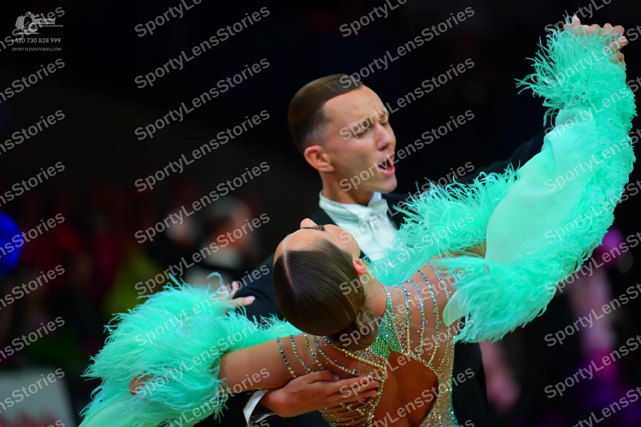 Dancesport competitor: Male dancer: black suit with a white shirt and white bowtie