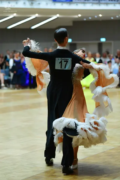 Dancesport competitor #17: Male dancer: black long-sleeved shirt and black trousers