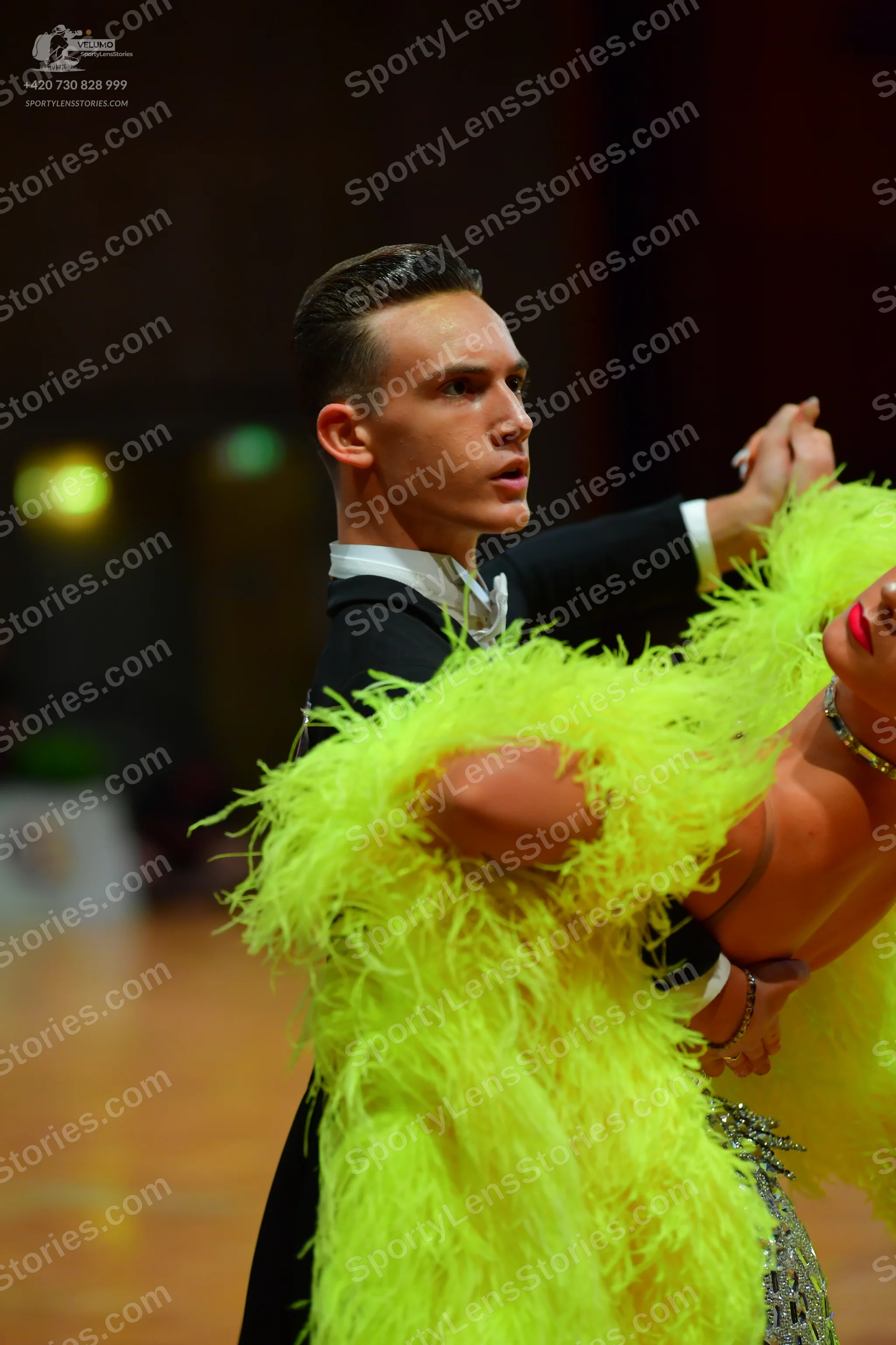 Dancesport competitor: Male dancer: black suit with a white shirt
