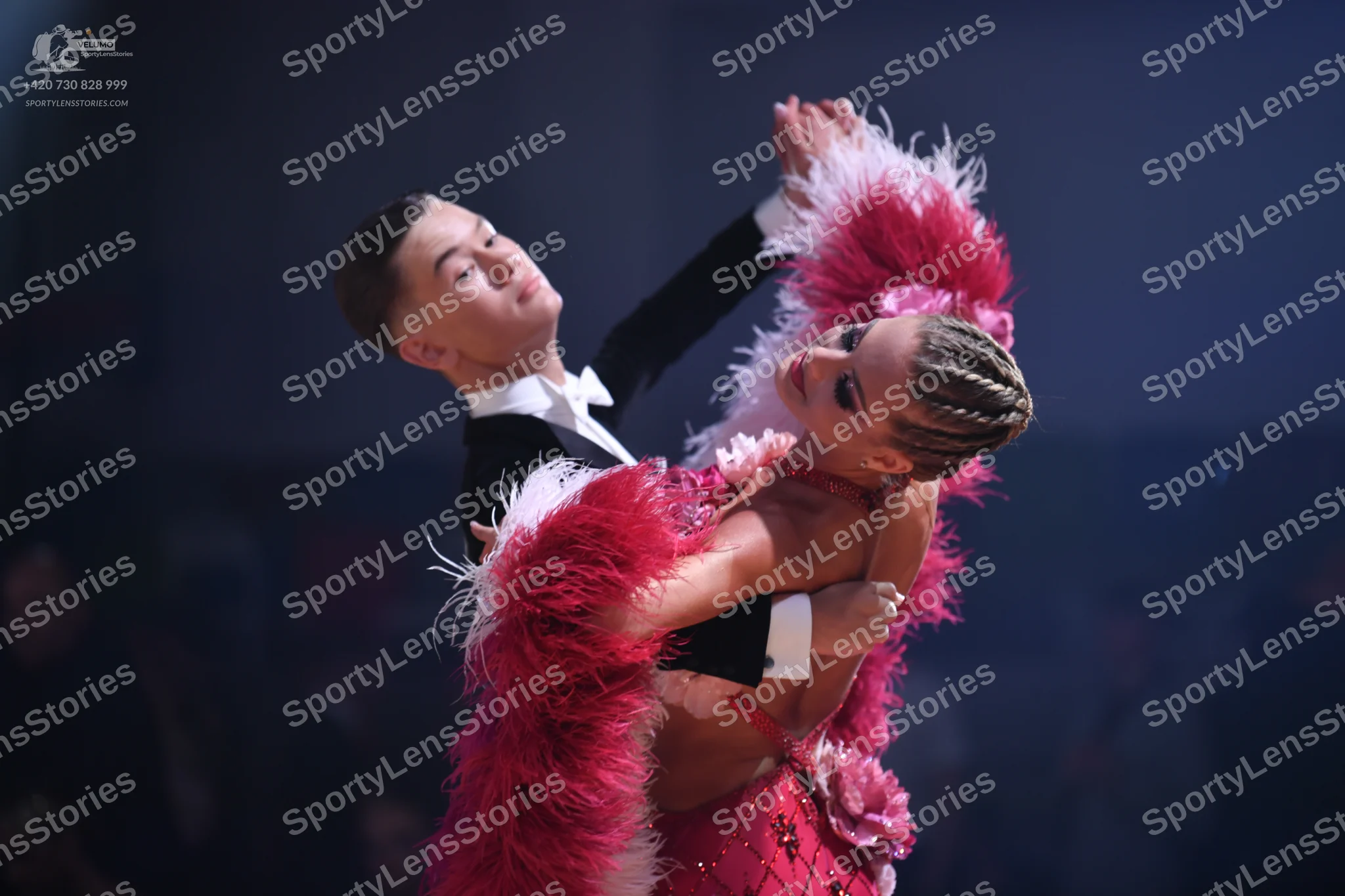 Dancesport competitor: Male dancer: black suit with white shirt and white bow tie