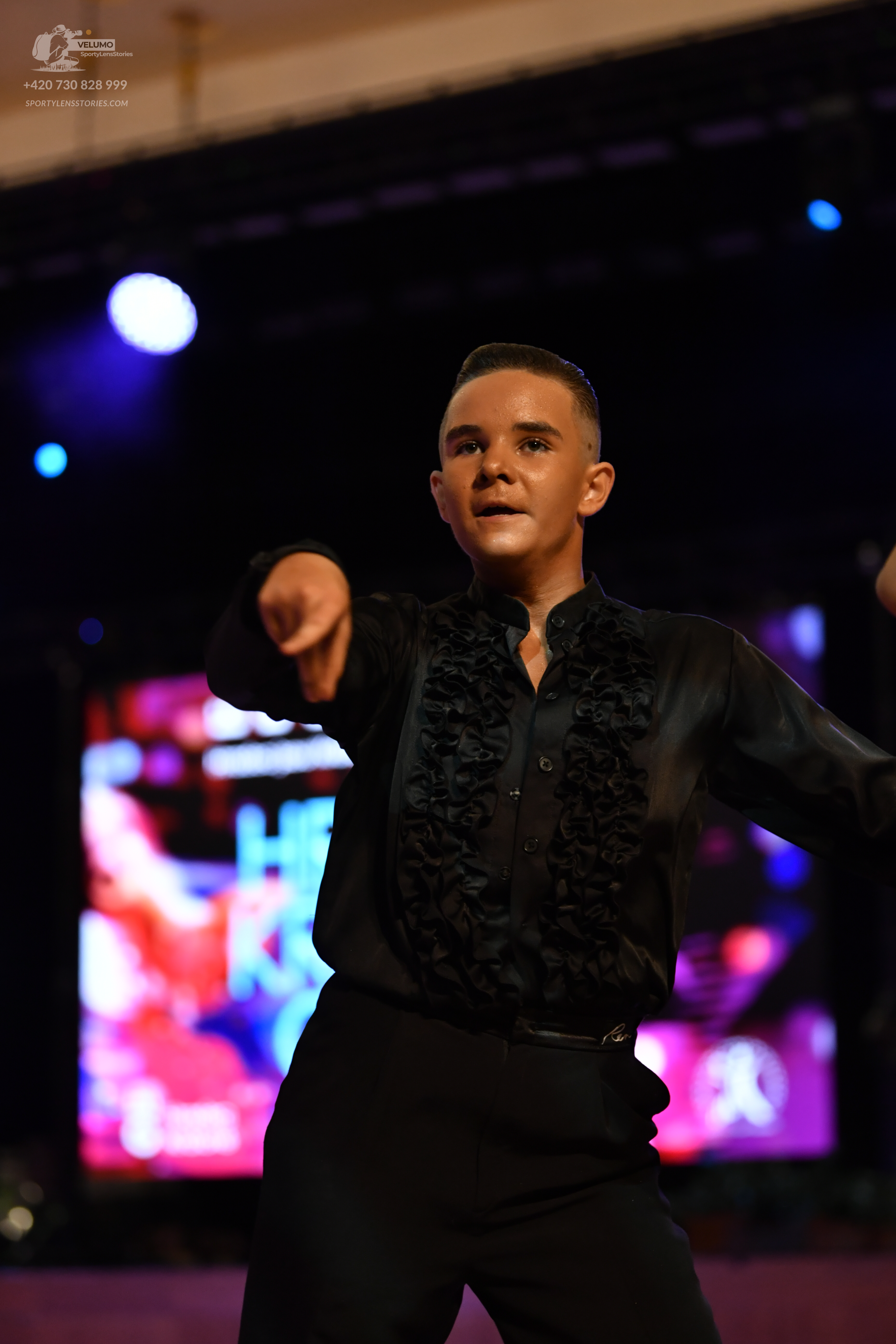 Dancesport competitor: **

*   **Male Dancer 1:** Costume: Black tailsuit