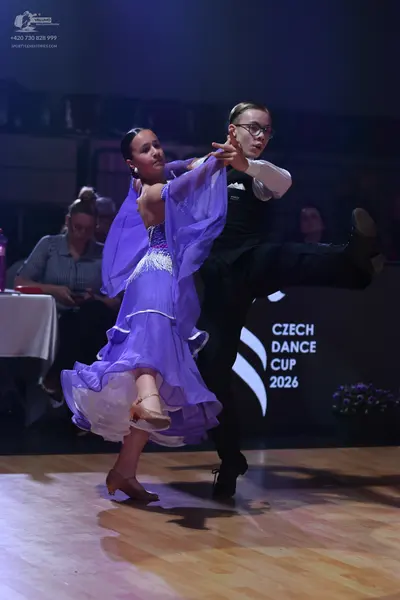 Dancesport competitor: Male dancer: black long-sleeved shirt and black trousers