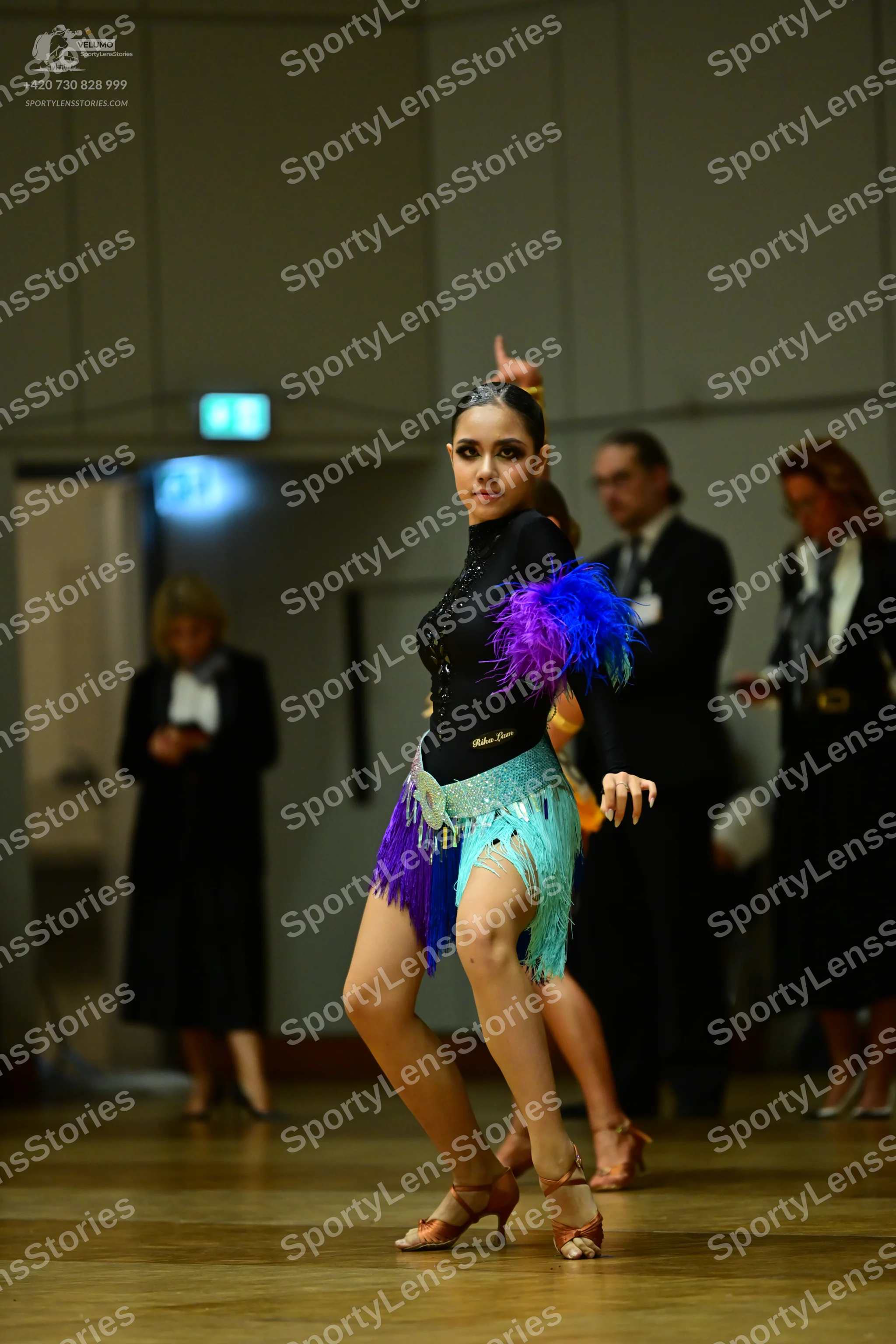 Dancesport competitor: Male dancer: black suit with white shirt and black tie