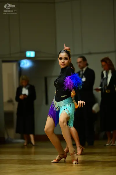 Dancesport competitor: Male dancer: black suit with white shirt and black tie