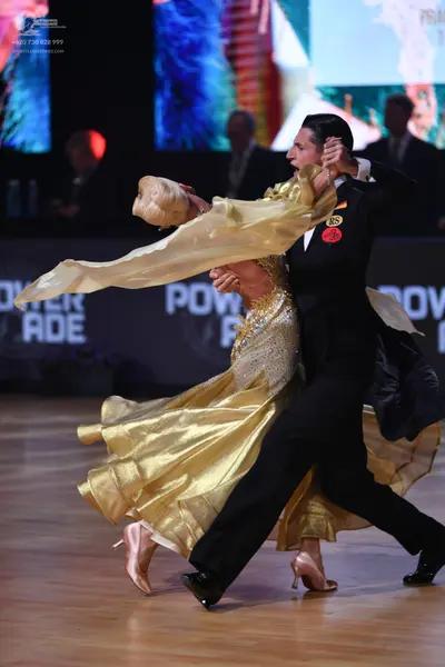 Dancesport competitor: Male dancer: black suit
