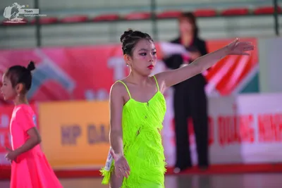 Dancesport competitor: ** Pink Latin Dress
*   **Color:** Bright pink
*   **Fabric:** Appears to be a s