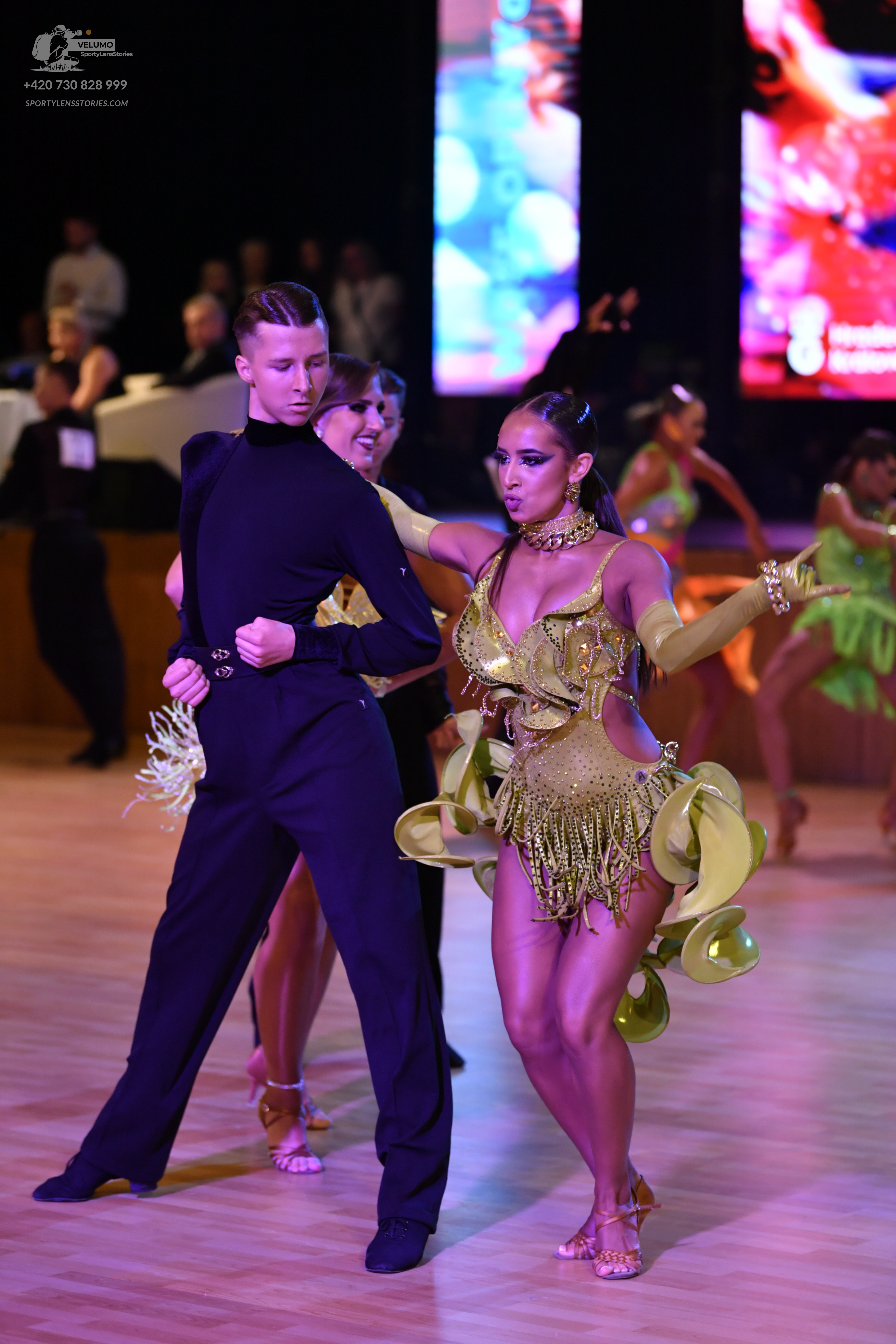 Dancesport competitor: ** Black tail suit with silver sequin detailing on the lapels