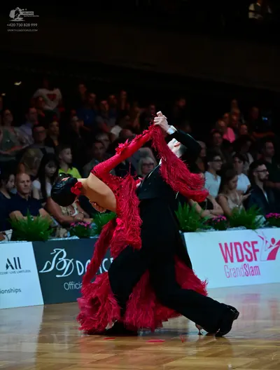 Dancesport competitor: Male dancer: black suit