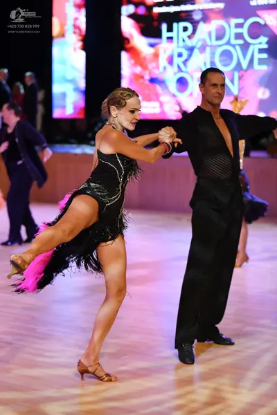 Dancesport competitor: ** Black tail suit