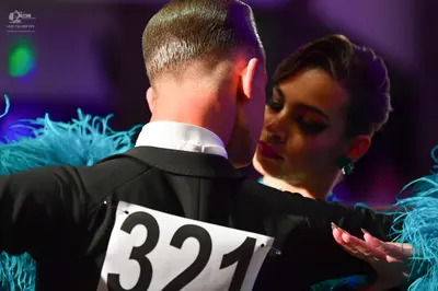 Dancesport competitor #321: Male dancer: black suit with a white collared shirt