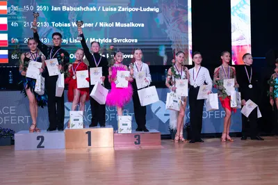 Dancesport competitor: Female dancer: blue sequined Latin dress