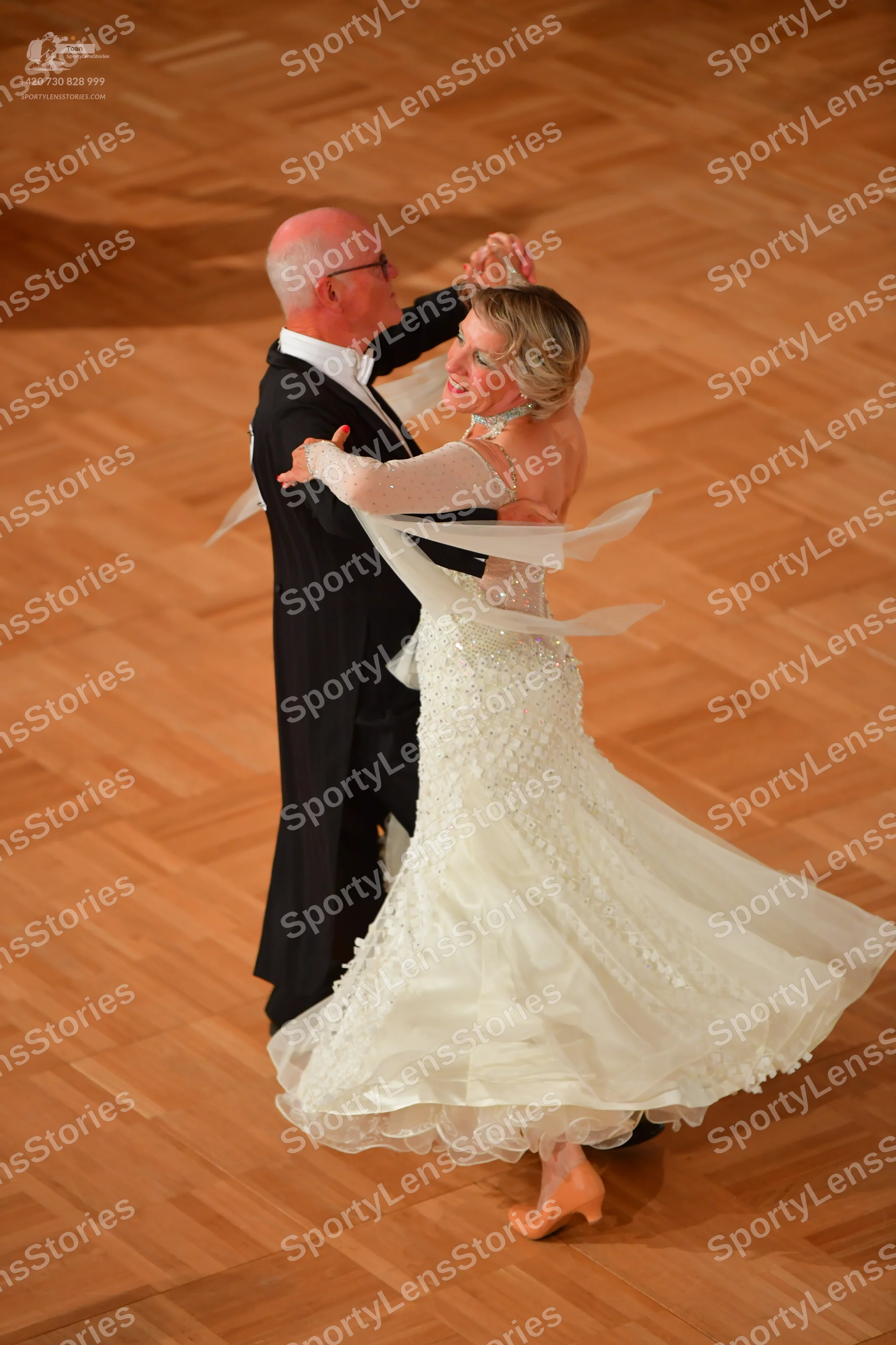 Dancesport competitor: Male dancer: black tailcoat with a white shirt and white bow tie