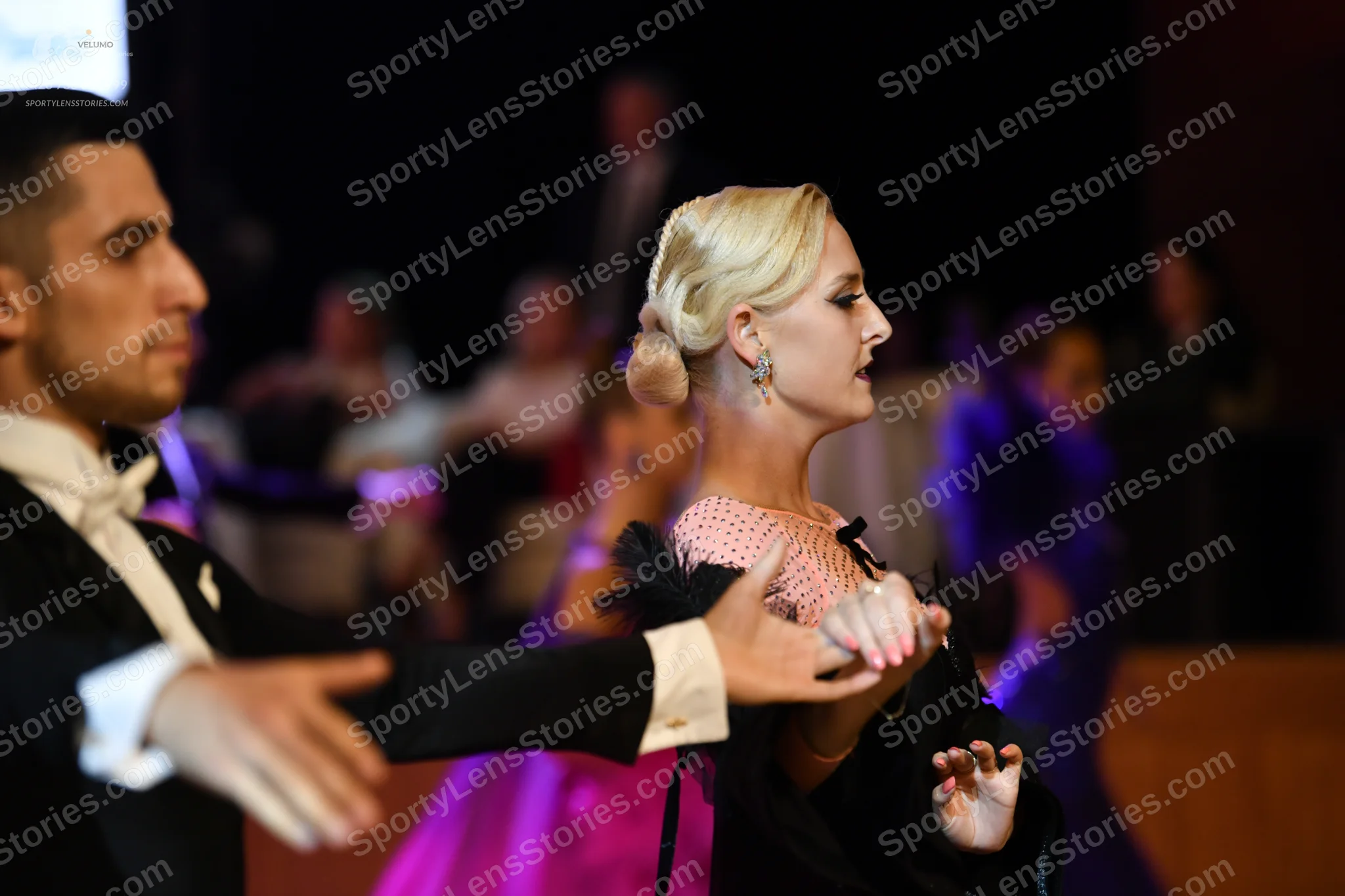 Dancesport competitor: Male dancer: black suit with a white shirt and white bow tie