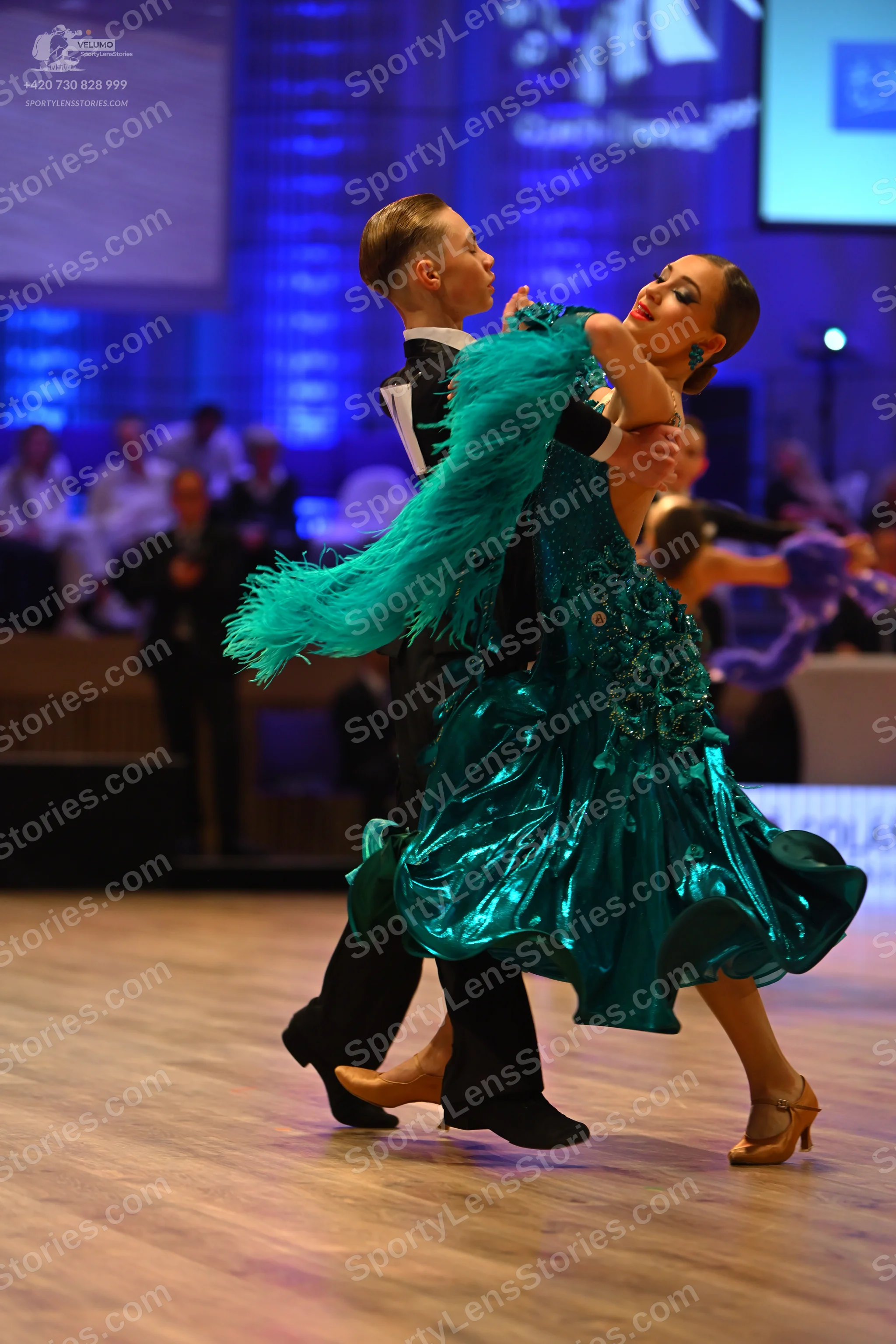 Dancesport competitor: Male dancer: black formal dance attire with a white shirt