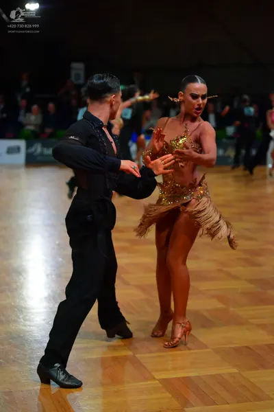 Dancesport competitor: Male dancer: black Latin dance shirt and trousers