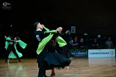 Dancesport competitor #10: Male dancer (left): black shirt and trousers