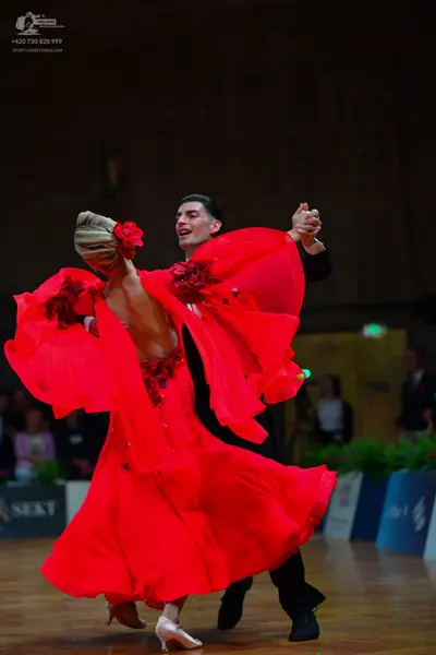 Dancesport competitor: Male dancer: black suit with a black shirt