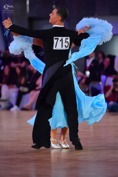 Dancesport competitor #715: Male dancer: black suit