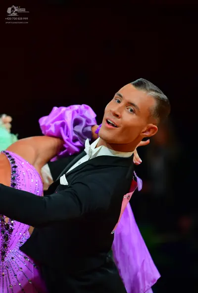 Dancesport competitor: Male dancer: black suit with a white shirt