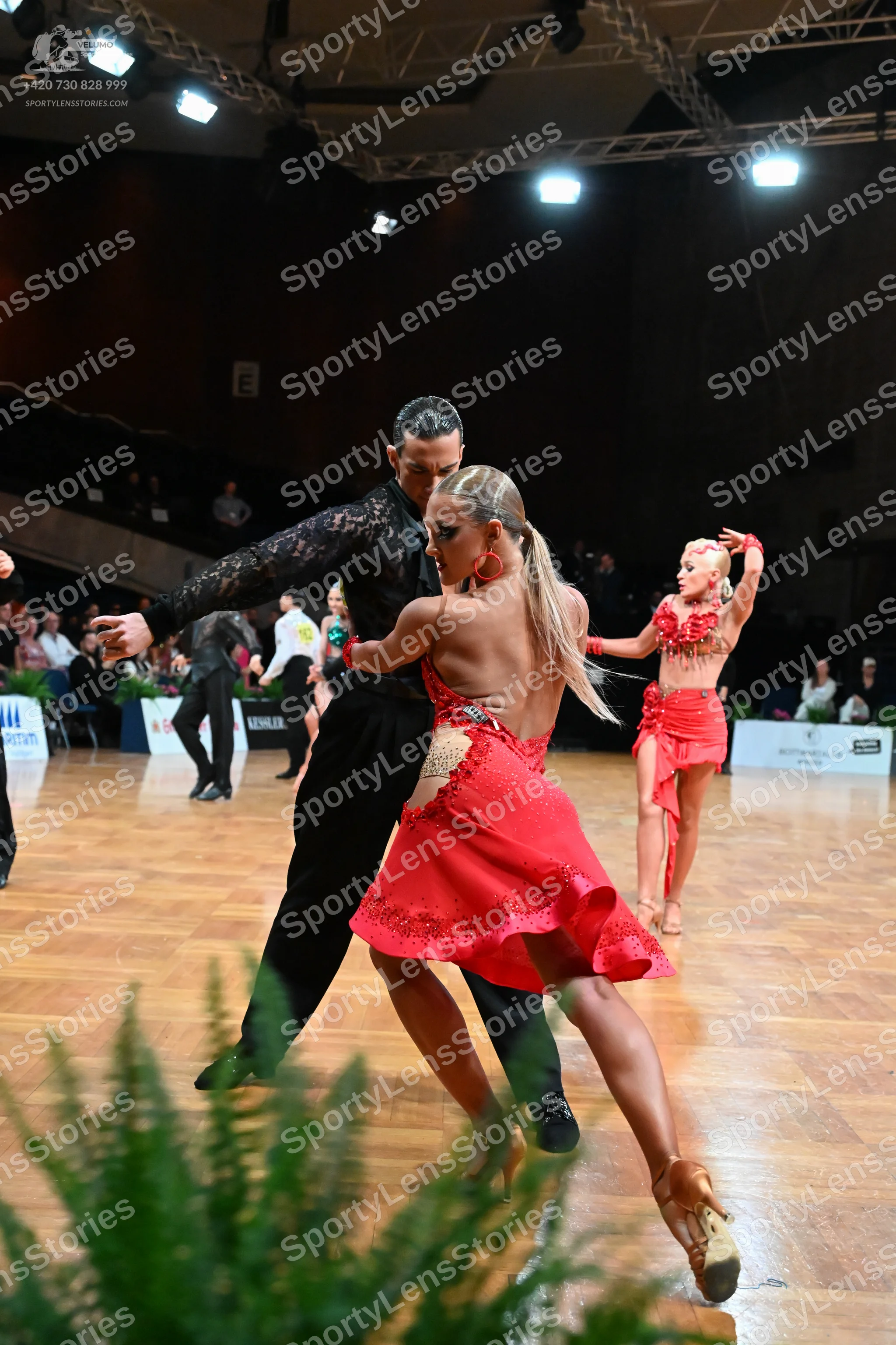 Dancesport competitor: Male dancer: black long-sleeved sequined shirt and black trousers