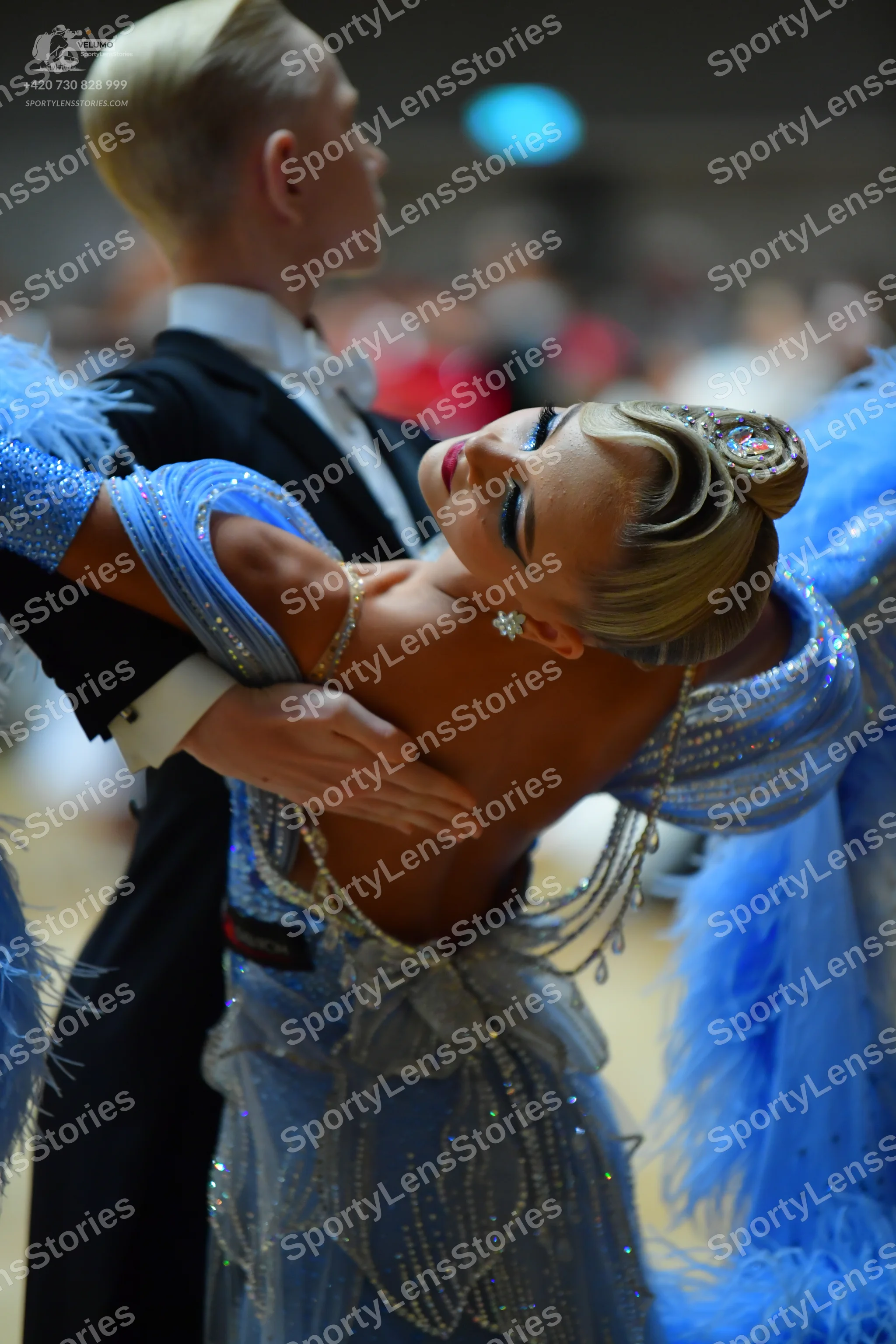 Dancesport competitor: Male dancer: black suit with a white shirt and white bow tie