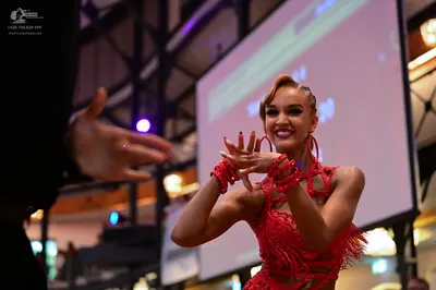Dancesport competitor: Female dancer: red latin dress with fringe